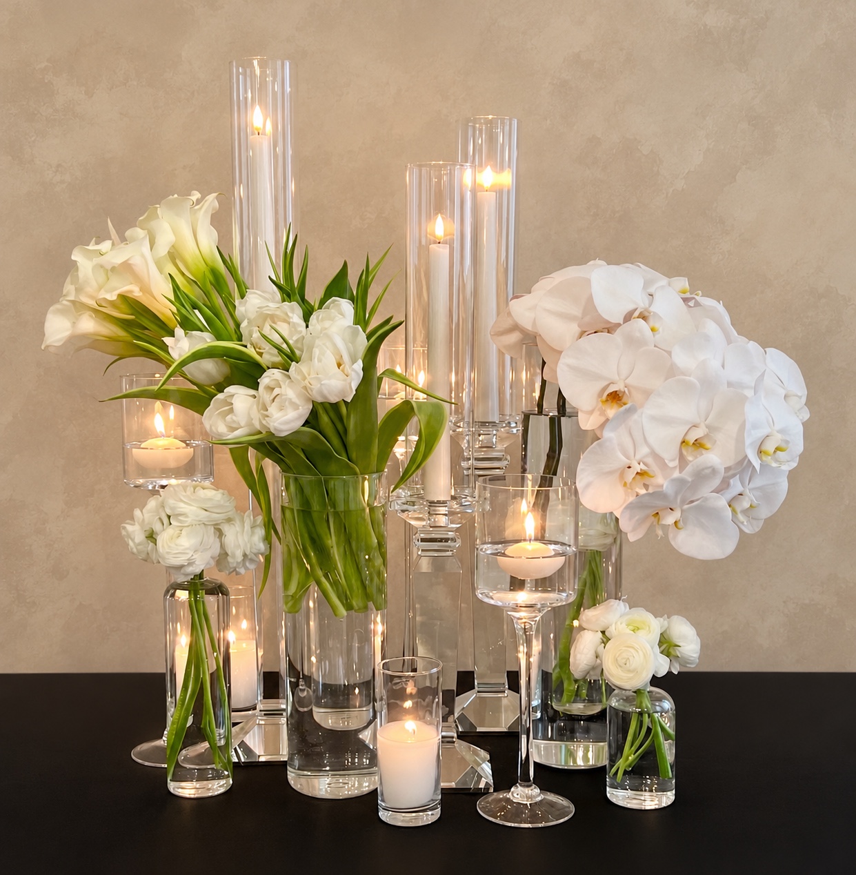 Camille Lopez candlelit floral installation featuring white calla lilies, tulips, orchids, and clear glass vessels
